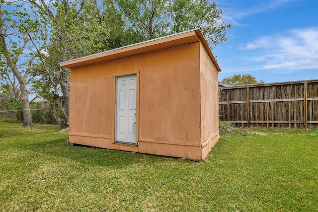 318 S Fulton St, Texas City, TX 77591 - view of outbuilding with an outdoor structure and a fenced backyard