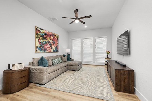 living room featuring visible vents, baseboards, light wood-type flooring, recessed lighting, and a ceiling fan