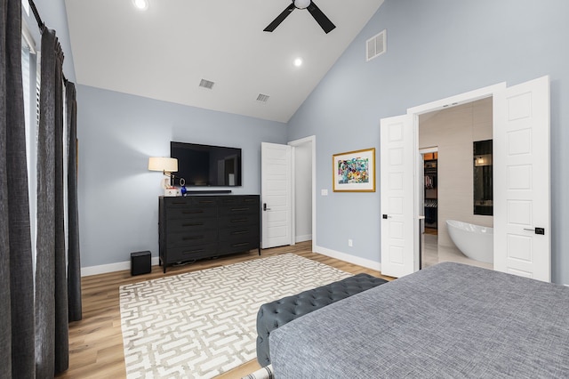 bedroom with baseboards, visible vents, and light wood finished floors