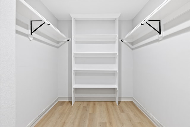 spacious closet with wood finished floors