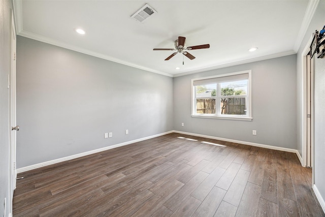 unfurnished bedroom featuring visible vents, crown molding, dark wood-type flooring, and baseboards