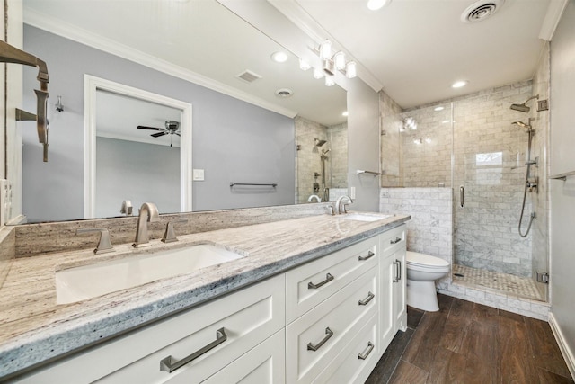 bathroom with ornamental molding, visible vents, and a sink