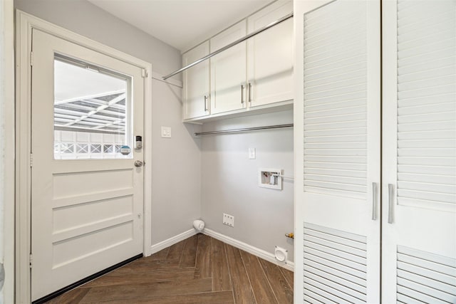 laundry room with hookup for a gas dryer, cabinet space, baseboards, and washer hookup