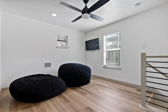 living area with visible vents, wood finished floors, recessed lighting, baseboards, and ceiling fan