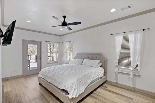 bedroom with light wood finished floors, visible vents, baseboards, and access to exterior