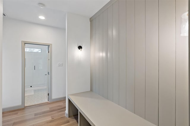 mudroom featuring recessed lighting, light wood-type flooring, and baseboards