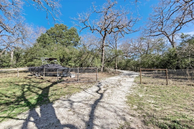 view of road featuring a gated entry