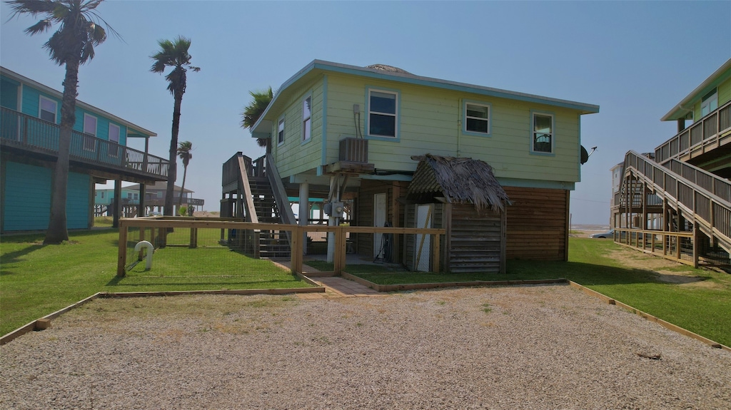 exterior space with a lawn and stairs