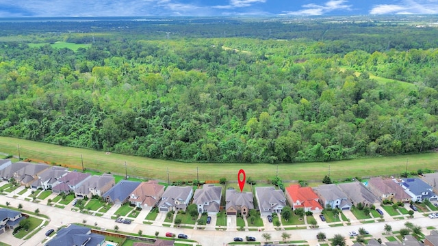 bird's eye view with a residential view and a view of trees