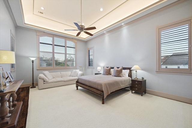 bedroom featuring visible vents, recessed lighting, a raised ceiling, and baseboards