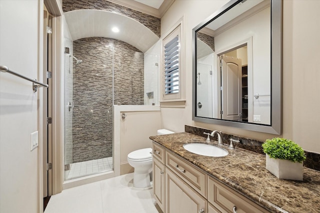 bathroom with vanity, toilet, and a stall shower