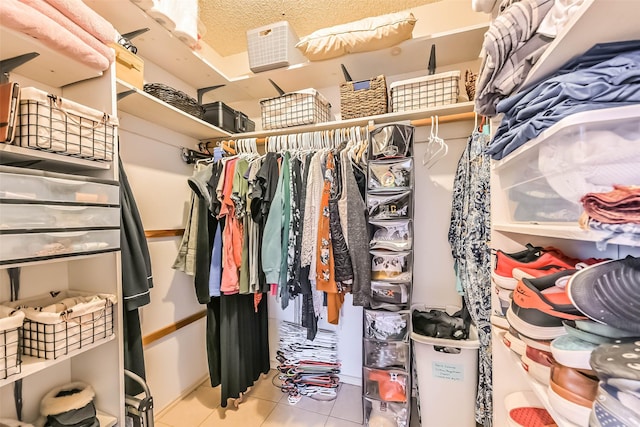 spacious closet with tile patterned flooring