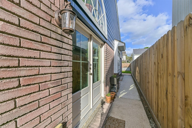 view of side of property with fence