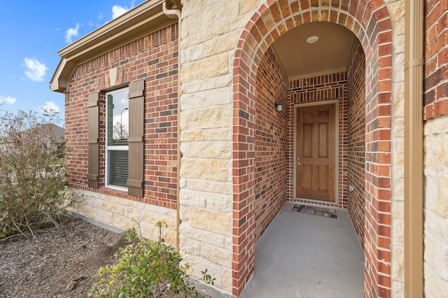 entrance to property with brick siding