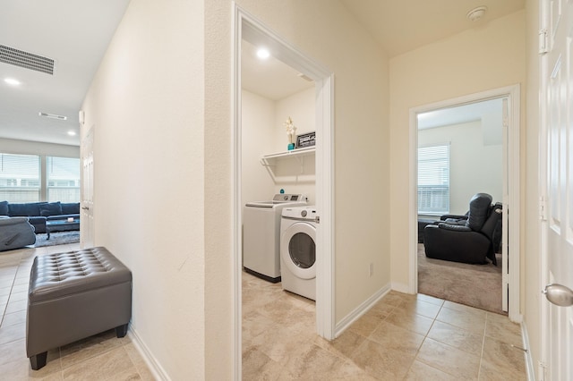 laundry area featuring laundry area, plenty of natural light, visible vents, and independent washer and dryer