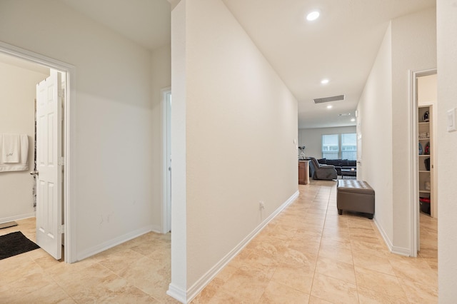 hall featuring recessed lighting, visible vents, and baseboards