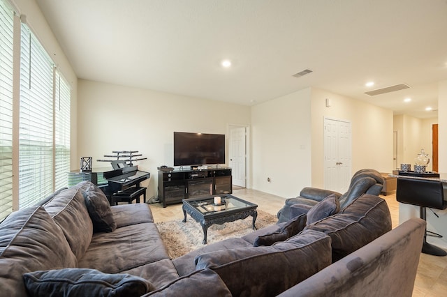 living area featuring recessed lighting and visible vents