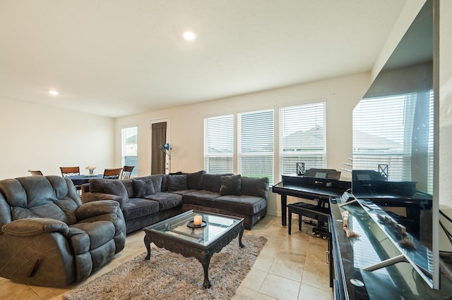 living room featuring light tile patterned floors and recessed lighting