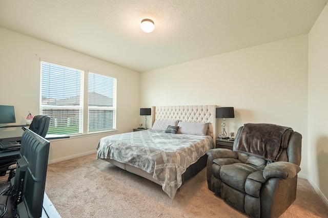 bedroom featuring carpet flooring and baseboards