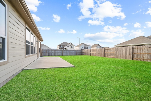 view of yard with a patio and a fenced backyard