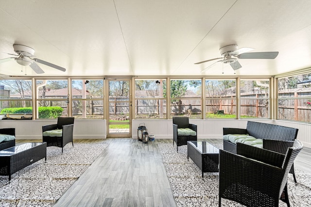 sunroom with a ceiling fan