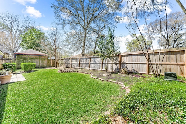 view of yard with a fenced backyard