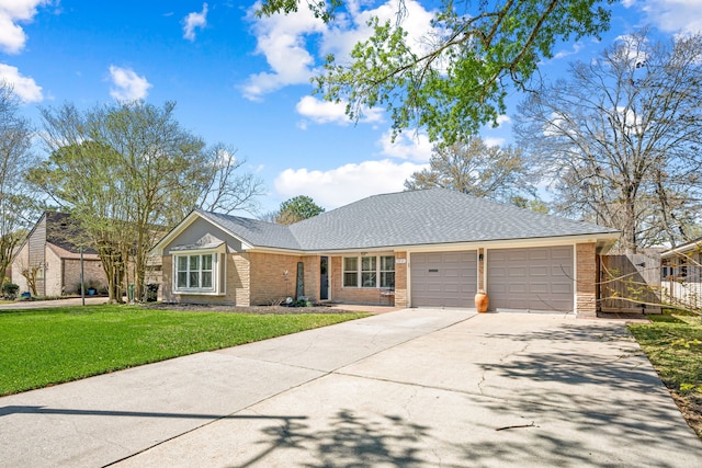 ranch-style home featuring concrete driveway, a front yard, a shingled roof, a garage, and brick siding