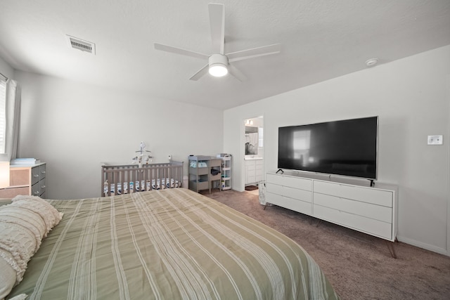 bedroom with a ceiling fan, carpet, visible vents, and connected bathroom