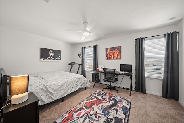 bedroom featuring ceiling fan, baseboards, and carpet