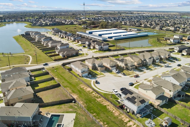 bird's eye view with a water view and a residential view