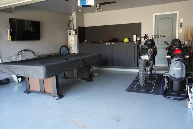 game room featuring gas water heater, pool table, and speckled floor