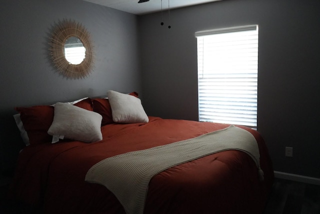 bedroom featuring baseboards