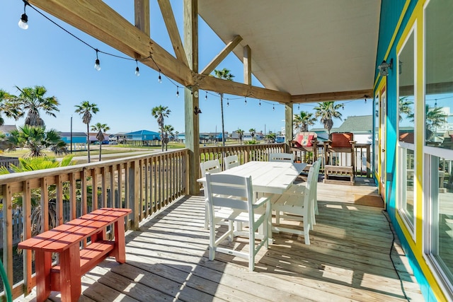 wooden deck featuring outdoor dining space