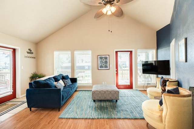 living room with lofted ceiling, wood finished floors, and ceiling fan