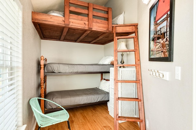 bedroom featuring wood finished floors