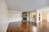 unfurnished living room featuring baseboards and a fireplace