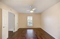 empty room featuring baseboards and wood finished floors