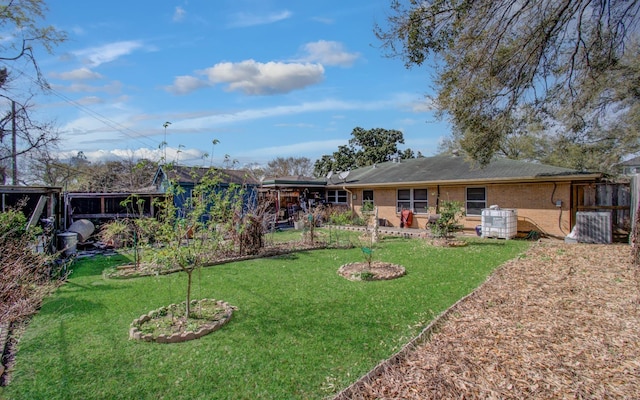 exterior space featuring brick siding and a lawn