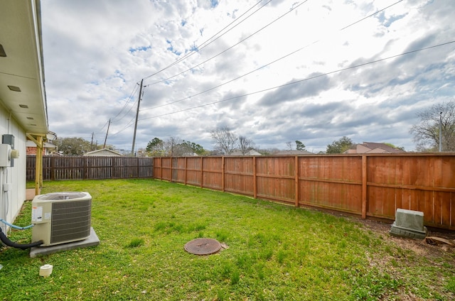 view of yard featuring cooling unit and a fenced backyard