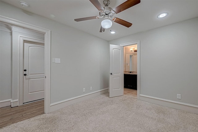 unfurnished bedroom with carpet flooring, recessed lighting, ensuite bathroom, and a ceiling fan
