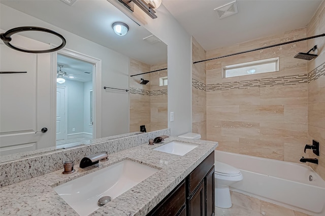 full bath featuring visible vents, shower / washtub combination, toilet, and a sink