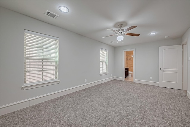 unfurnished bedroom featuring visible vents, recessed lighting, baseboards, and carpet floors