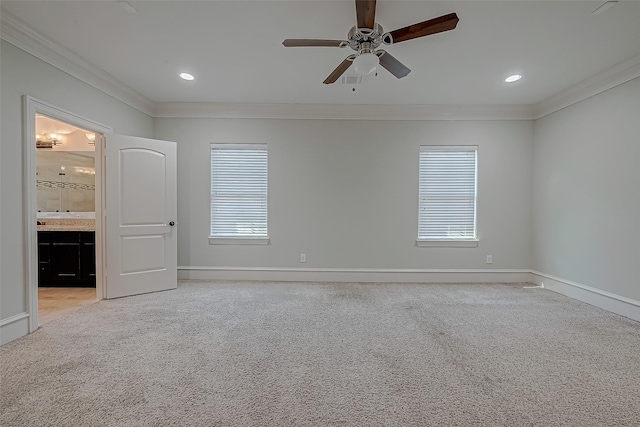 unfurnished room featuring crown molding, baseboards, light colored carpet, recessed lighting, and a ceiling fan