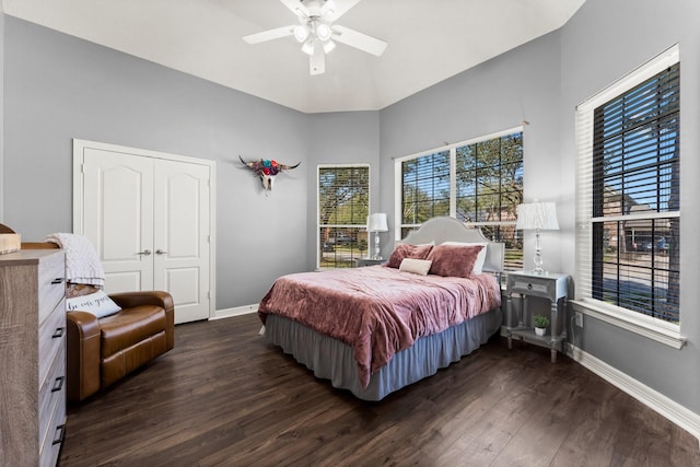 bedroom featuring ceiling fan, dark wood-type flooring, and baseboards