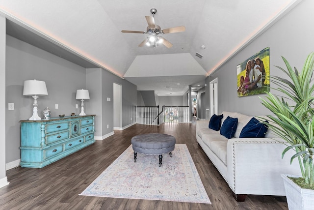 living room with vaulted ceiling, ceiling fan, baseboards, and dark wood-style flooring