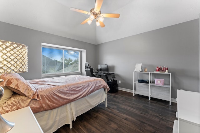 bedroom featuring baseboards, lofted ceiling, dark wood-style floors, and a ceiling fan