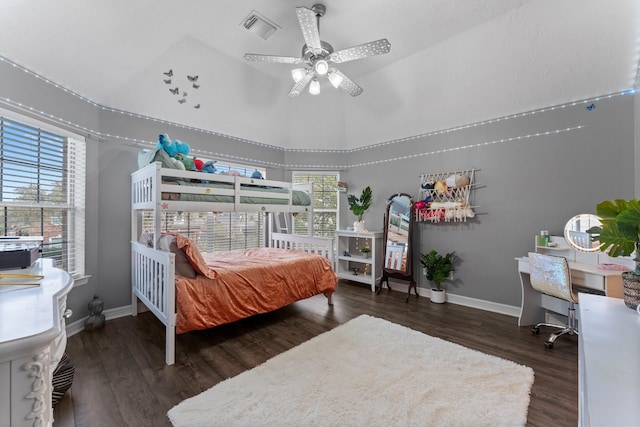 bedroom with visible vents, ceiling fan, baseboards, and wood finished floors