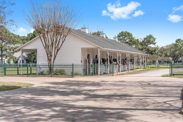 view of property's community featuring fence