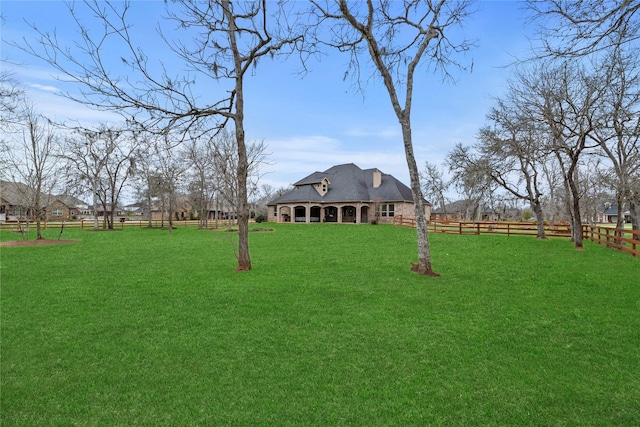 view of yard featuring fence