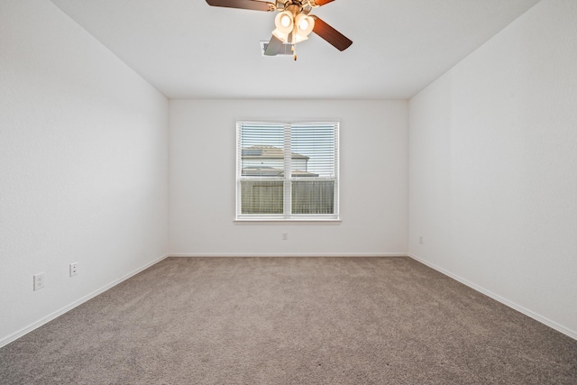 unfurnished room featuring baseboards, carpet floors, and ceiling fan